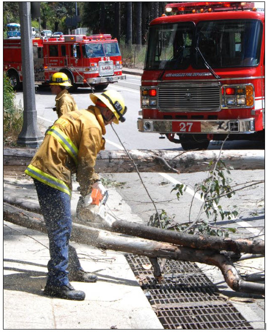 firefighter using carbide chainsaw
